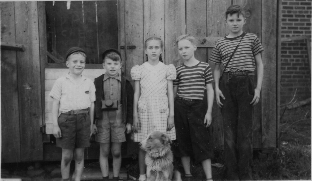A black and white photo of children in the 1940s.