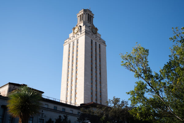 The tower at the University of Texas at Austin is seen against a blue sky