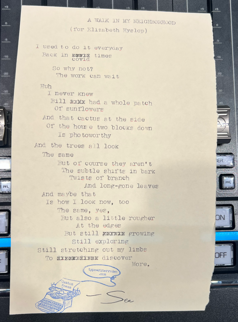 A photo of the typewritten poem on a torn half-sheet of light paper.