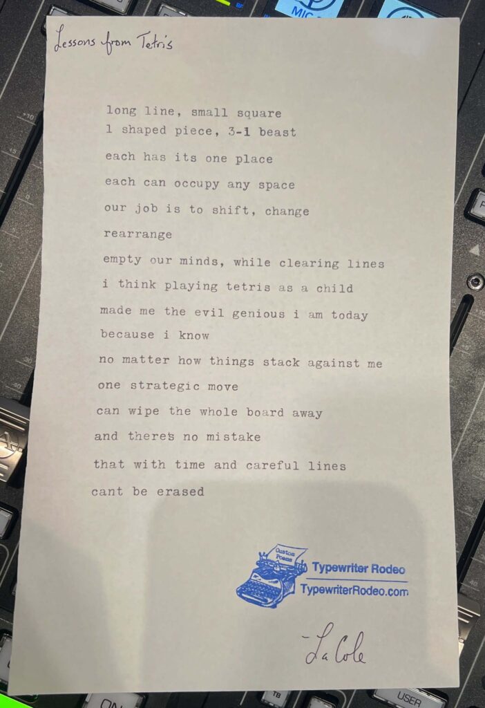 A photo of the typewritten poem on a torn half-sheet of light yellow paper.