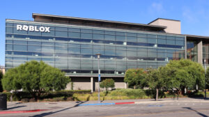 An office building with large white letters that read "Roblox"