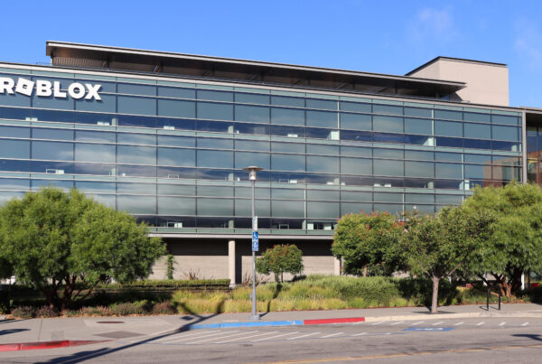 An office building with large white letters that read "Roblox"