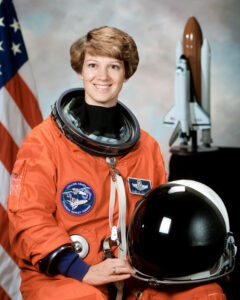 STS-93 Commander, Eileen Collins shown wearing an orange Launch and Entry Suit with helmet. Collins was the first woman to command a Space Shuttle mission.