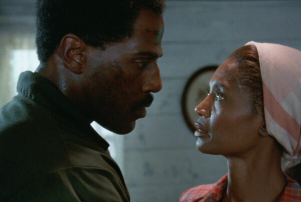 A screenshot from the 6k restoration of the film "Riverbend" shows Steve James, left, and Margaret Avery in a close conversation.