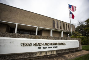 a view of the sign in front of the Texas Department of Health and Human Services office in Austin